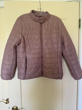 Lightweight quilted jacket with zippered pockets.
